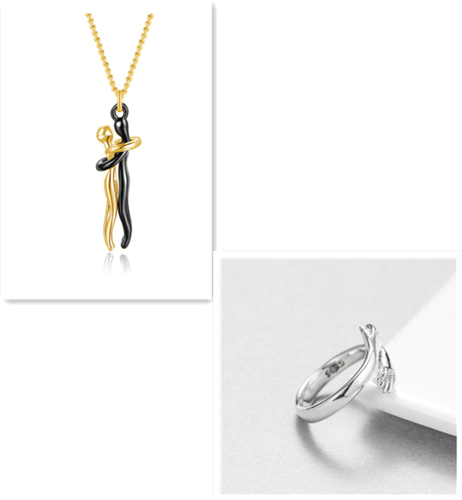 Gold hug pendant necklace and silver ring set with interlocking figure charm