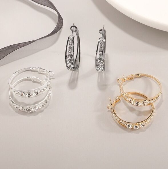Hoop earrings in silver and gold tones with pavé mosaic stones, hinged backs