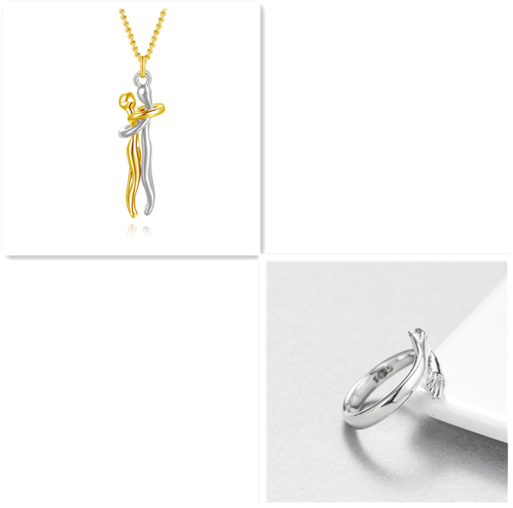 Gold love hug pendant necklace with silver tone ring and chain