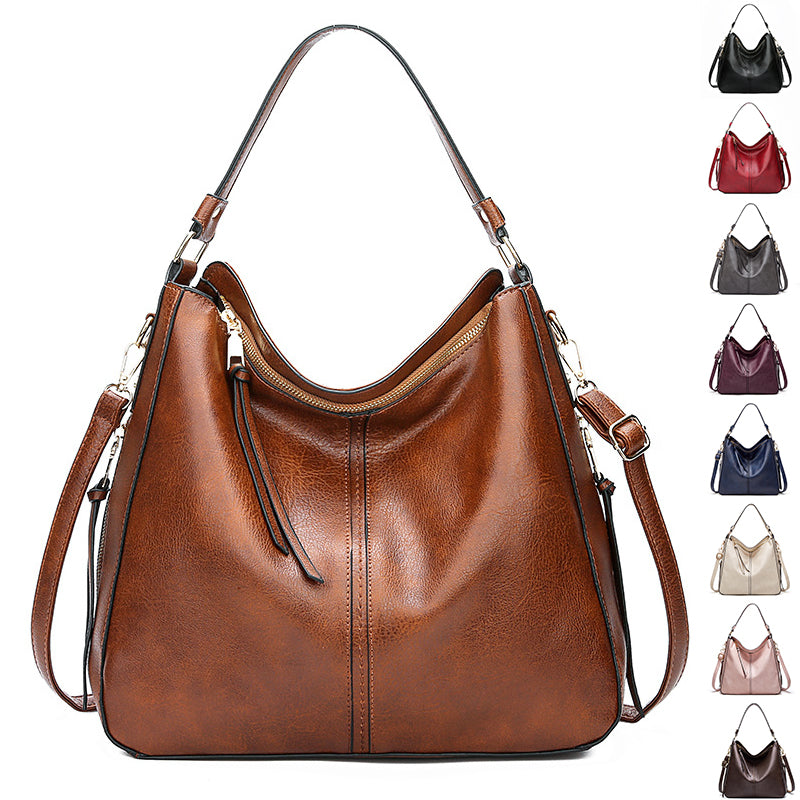 Hobo bucket handbag with zip top and adjustable shoulder strap, dark brown leather-look