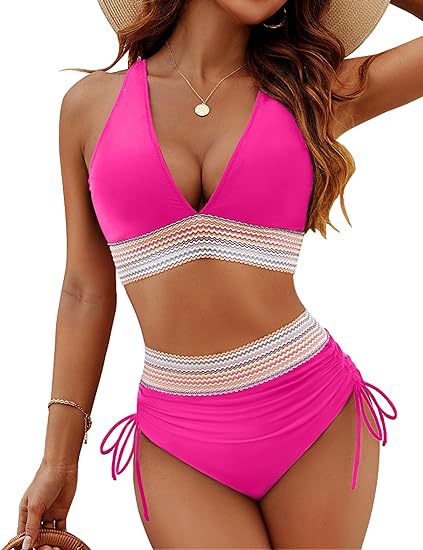 Woman wearing a pink bikini with a white and beige patterned accent on a white background