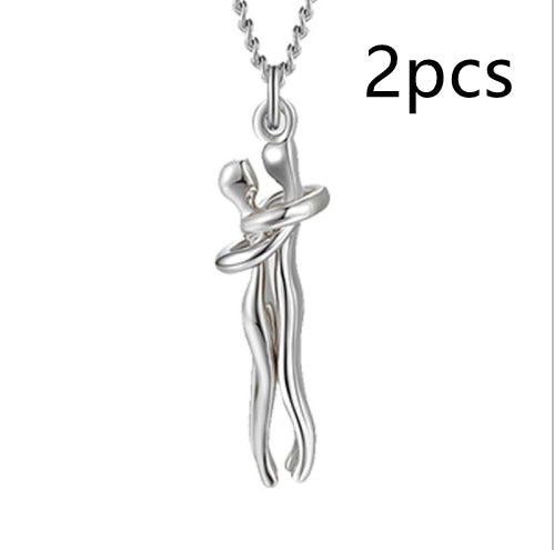 Silver-tone love hug pendant necklace with two linked figures, silver chain