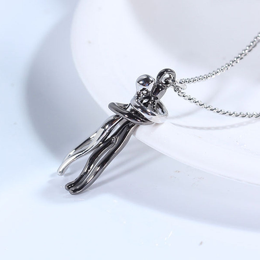 Silver hug pendant necklace with interlocking figure charm on a chain