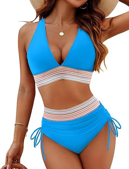 Blue and white striped swimsuit worn by a model on a white background