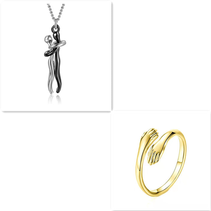 Silver love hug pendant necklace with gold tone hugging ring