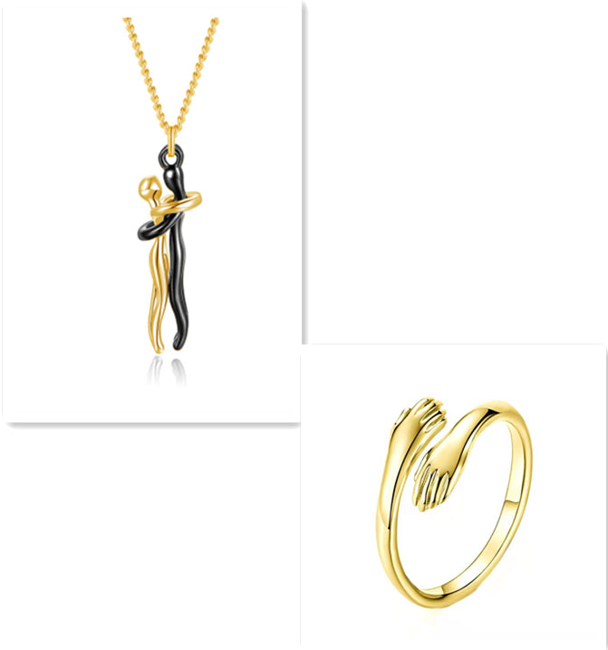 Gold hug pendant necklace and matching gold ring set with interlocking figure charm