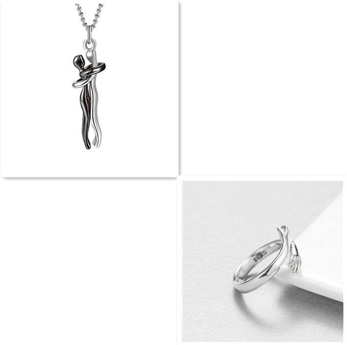 Black-tone love hug pendant necklace with two clasped figures, silver chain
