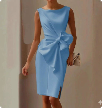Light blue dress with a large bow detail on a neutral background