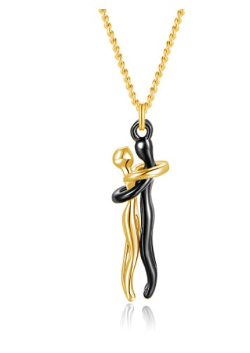 Gold hug pendant necklace with black and gold interlocking figure charm